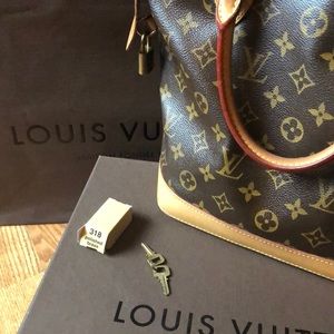 Louis Vuitton LockIt PM Bag